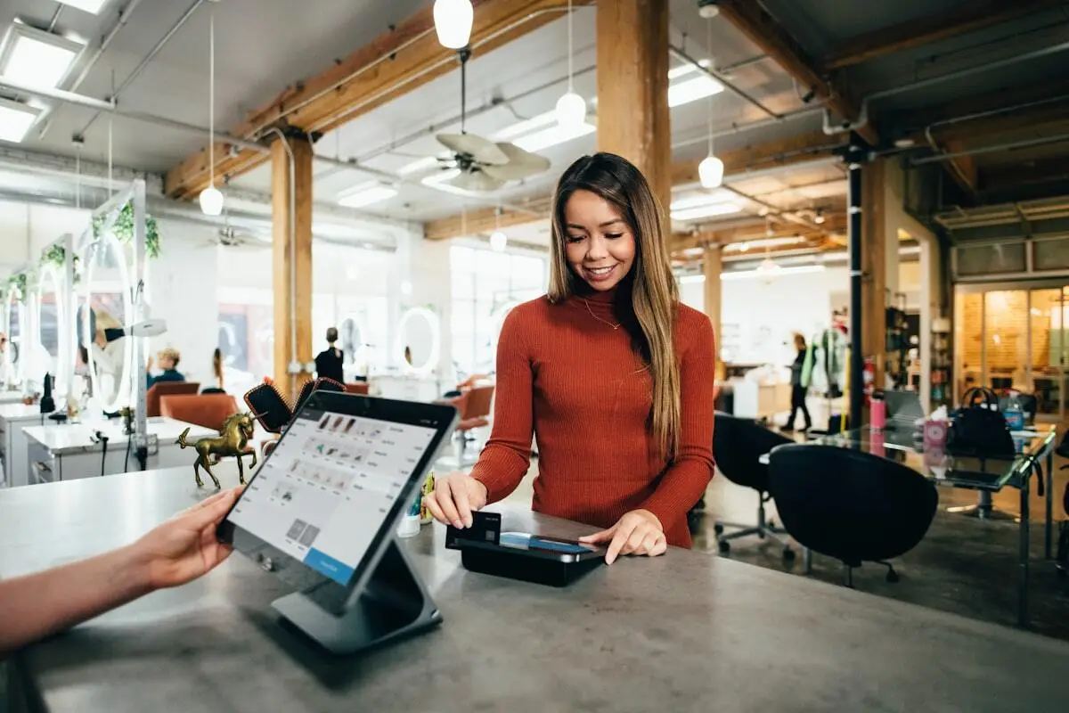 Business owner sending a voice note to a sales assistant